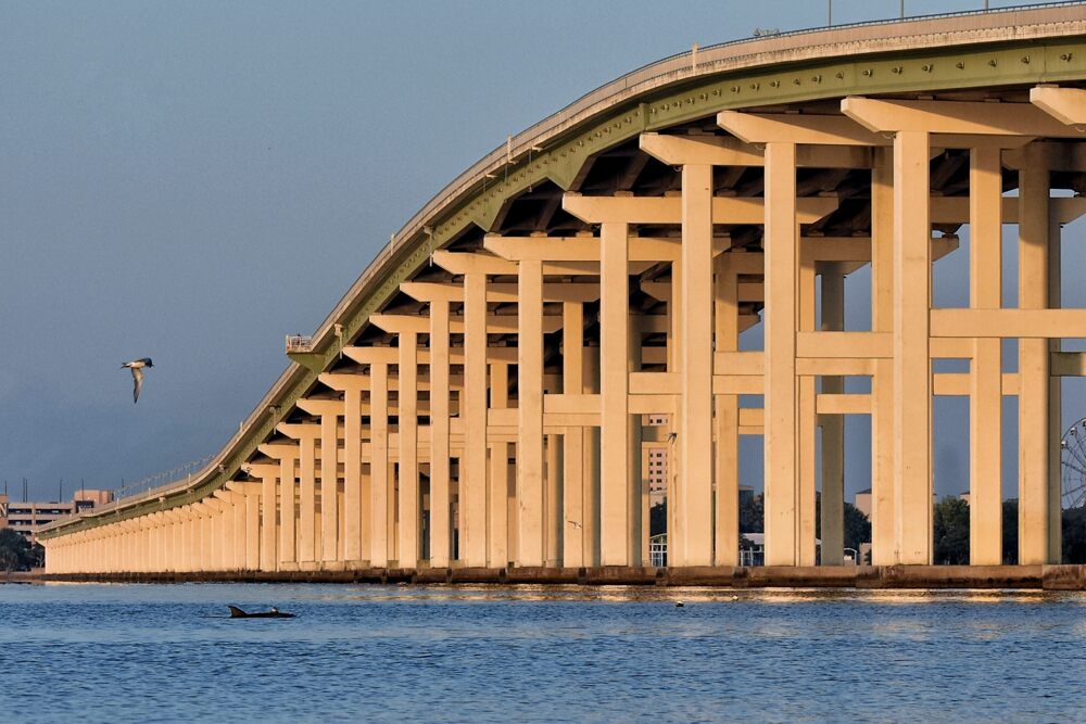 The arched Biloxi Bay bridge in warm evening light