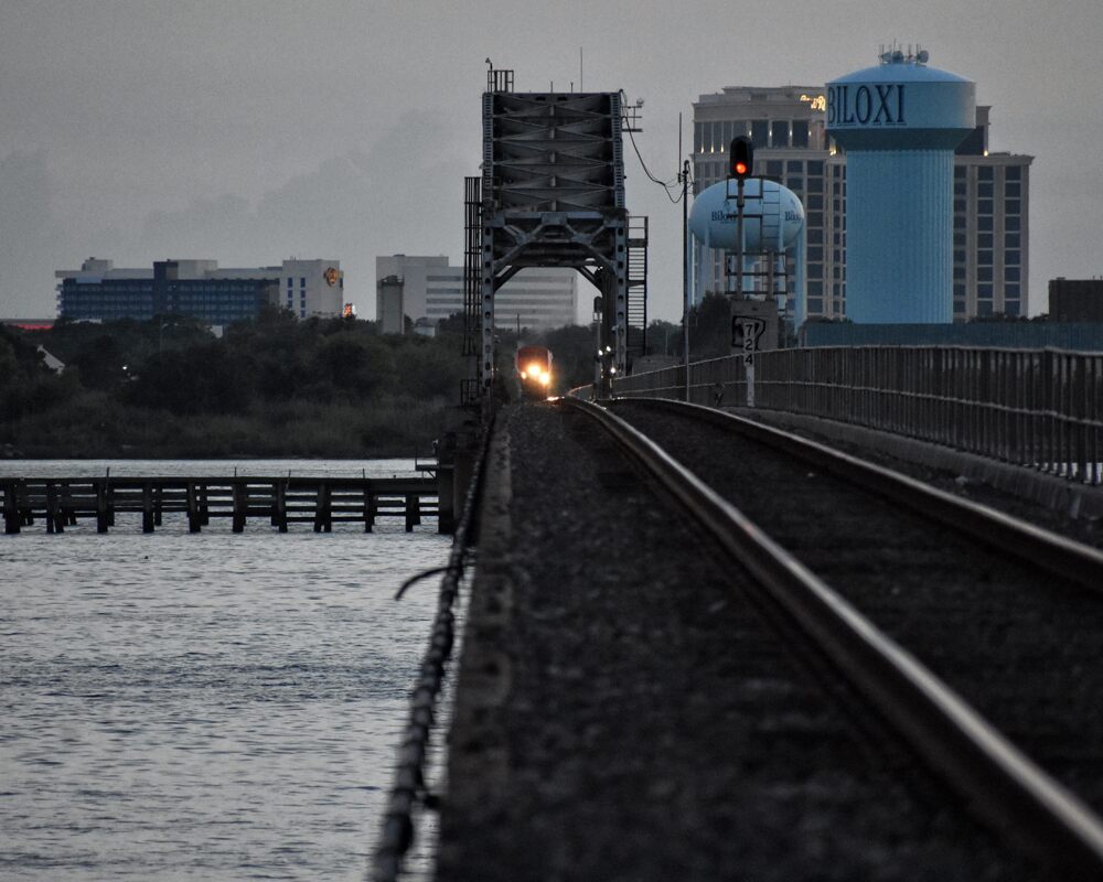 Railroad tracks running toward the Biloxi skyline